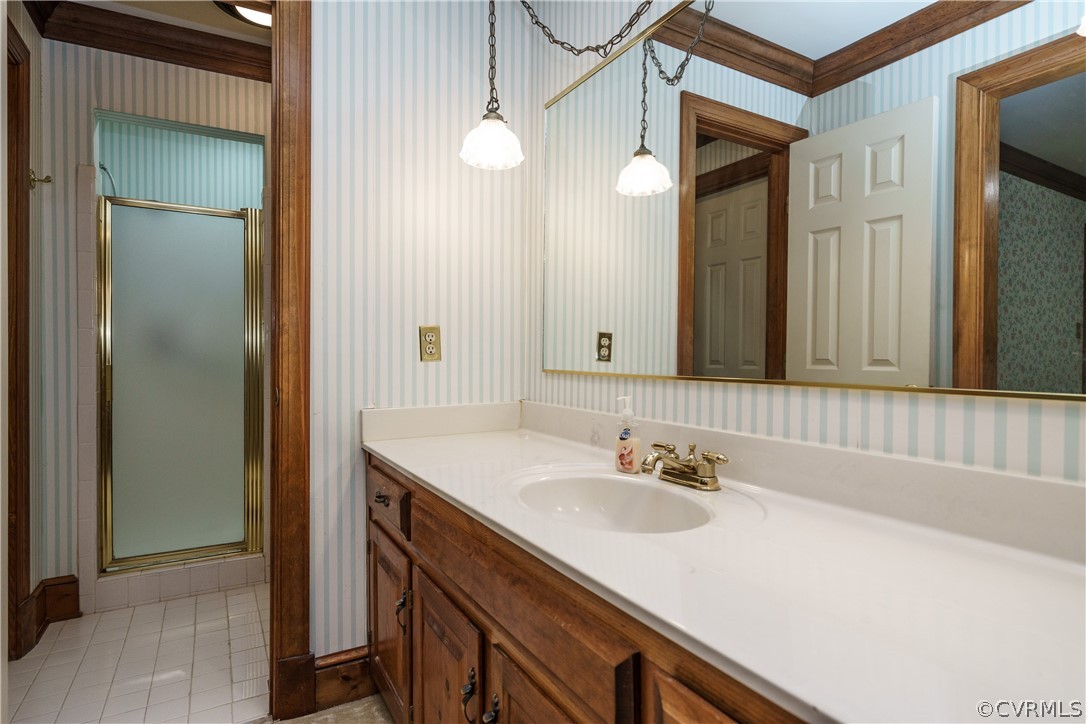 12901 Rivers Bend Road Chester, VA 23836 - Photo 20 of 29 a bathroom with a sink and a mirror