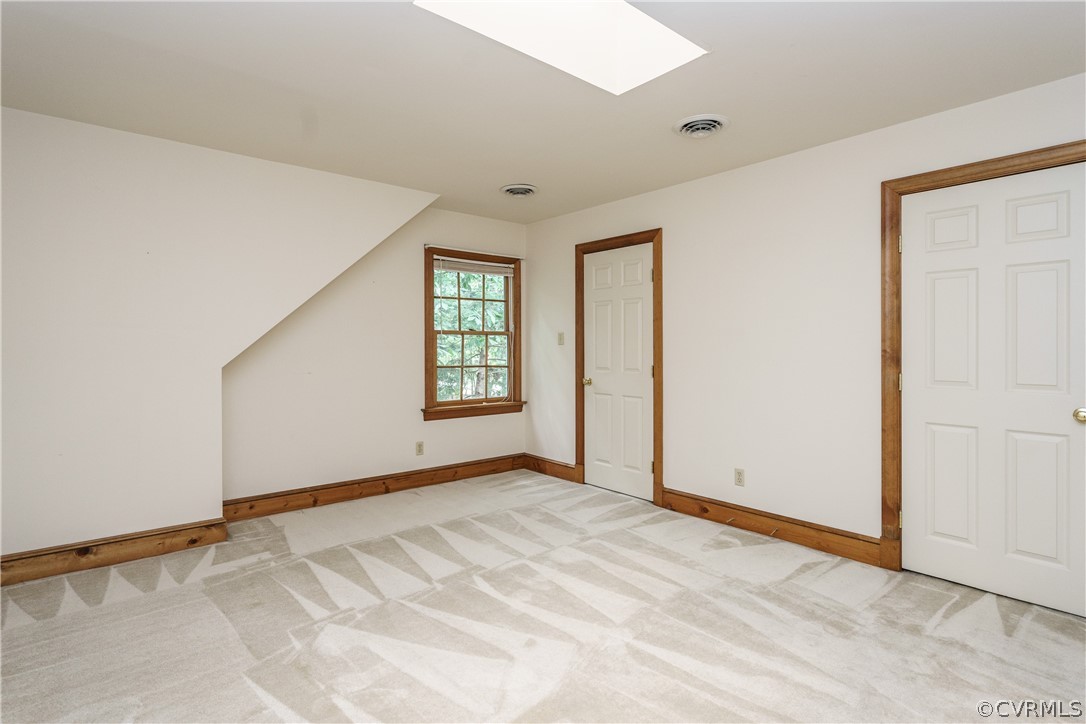 12901 Rivers Bend Road Chester, VA 23836 - Photo 22 of 29 an empty room with windows