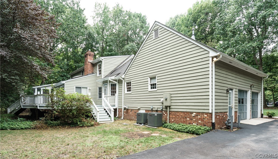 12901 Rivers Bend Road Chester, VA 23836 - Photo 29 of 29 a view of a house with a yard and plants