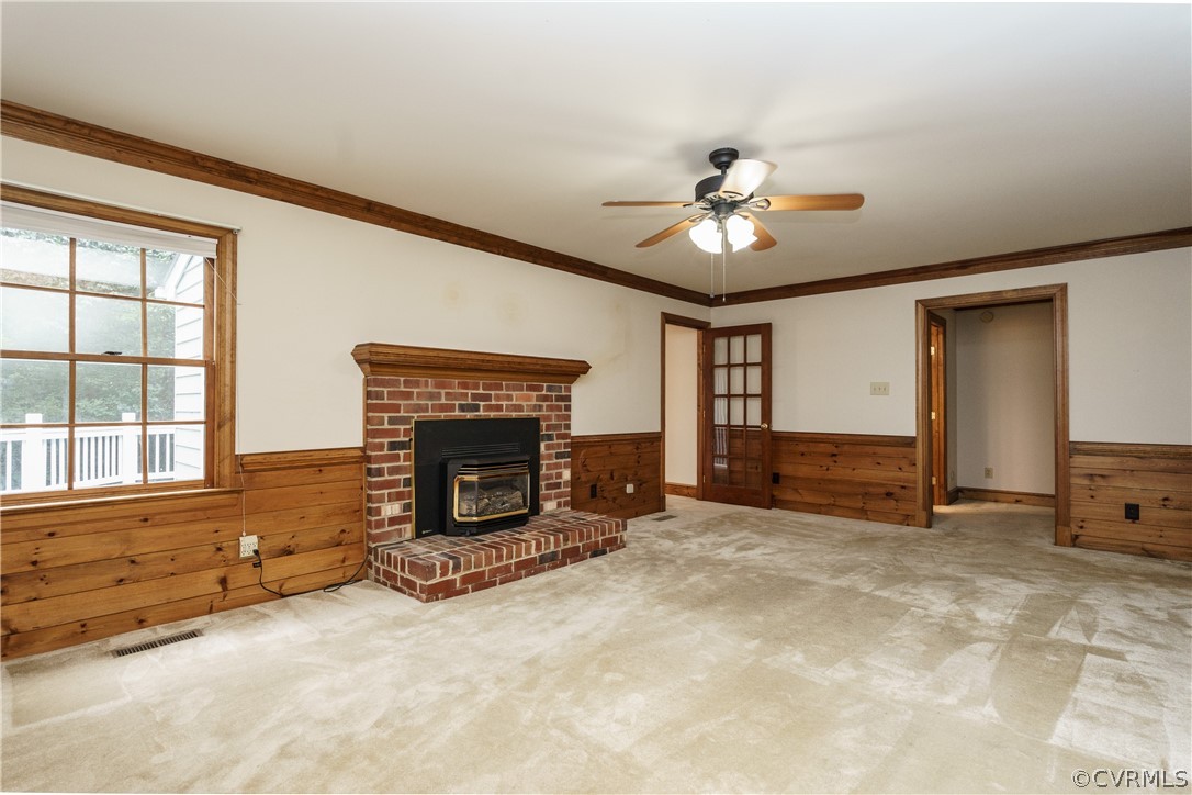 12901 Rivers Bend Road Chester, VA 23836 - Photo 9 of 29 an empty room with furniture and a fireplace