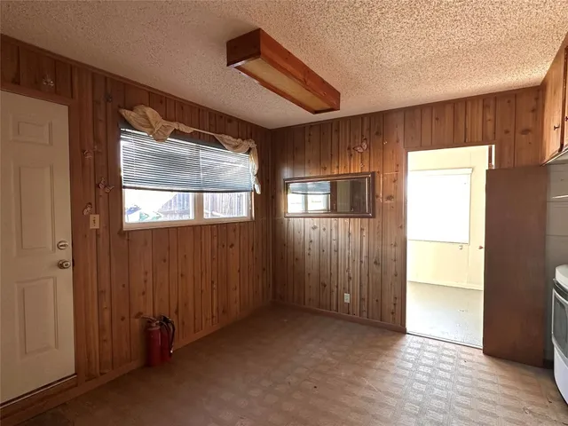 a kitchen with window and refrigerator