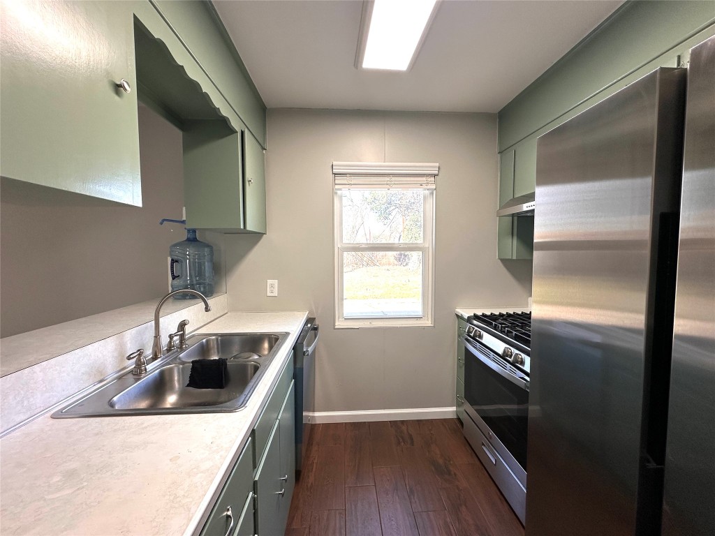 2500 Biggs Drive Austin, TX 78741 - Photo 8 of 23 a kitchen with a sink and a refrigerator