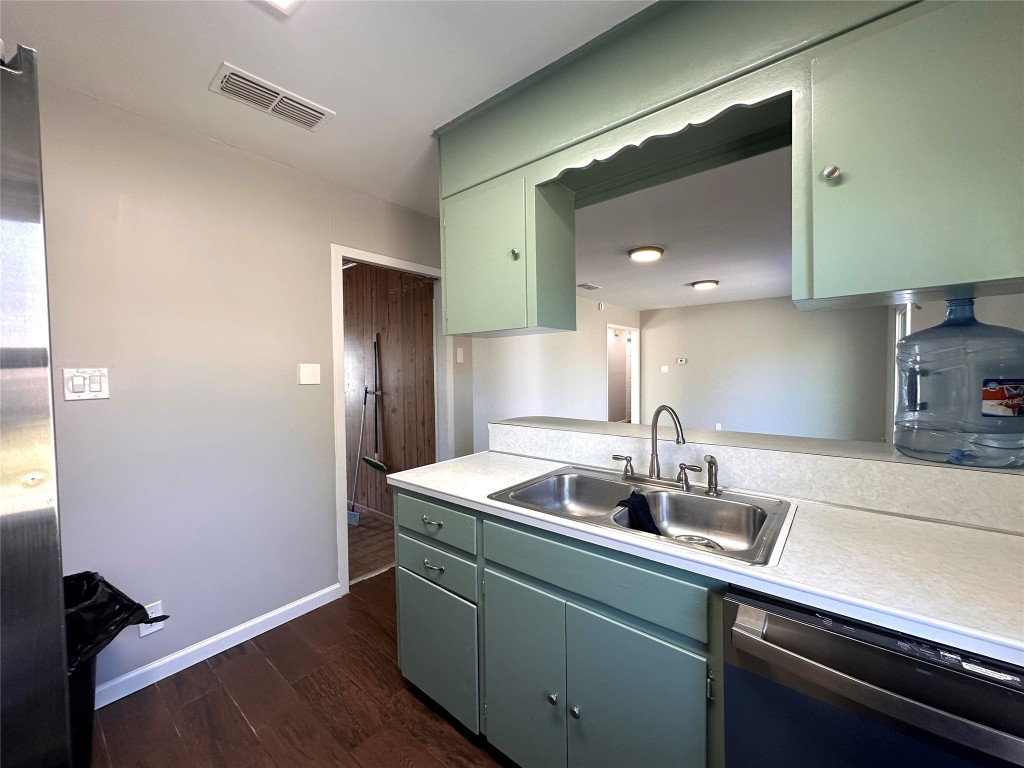 2500 Biggs Drive Austin, TX 78741 - Photo 9 of 23 a kitchen with a sink and refrigerator