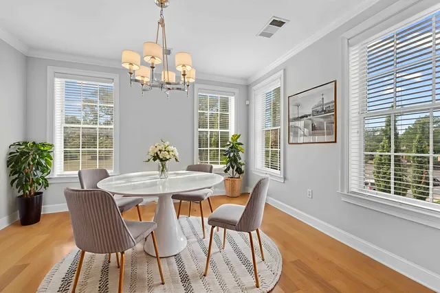a view of a dining room with furniture window and outside view