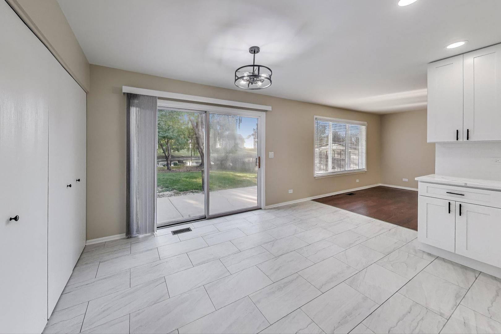 926 South W Avenue Waukegan, IL 60085 - Photo 12 of 45 a view of an empty room with a window