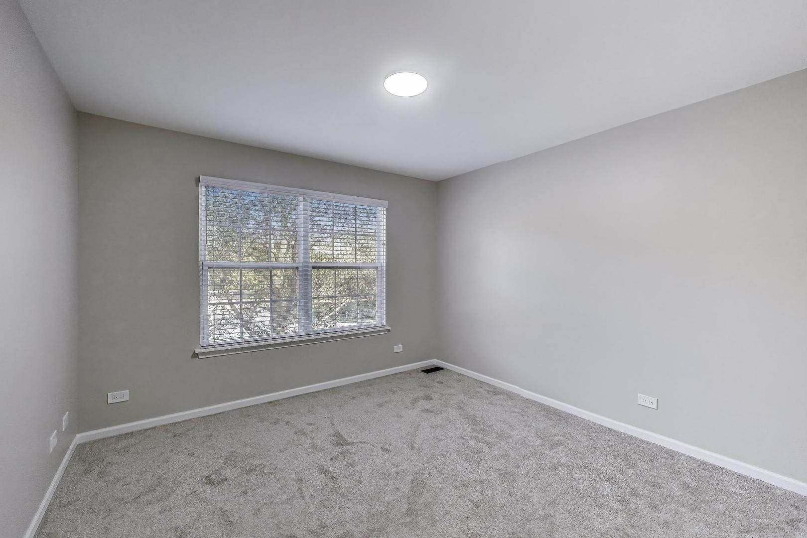 926 South W Avenue Waukegan, IL 60085 - Photo 25 of 45 an empty room with a window