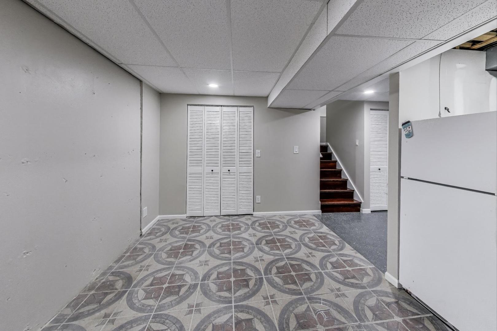 926 South W Avenue Waukegan, IL 60085 - Photo 30 of 45 a view of a hallway with closet and wooden floor