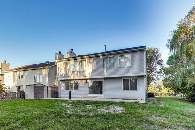 a view of front of house with a yard