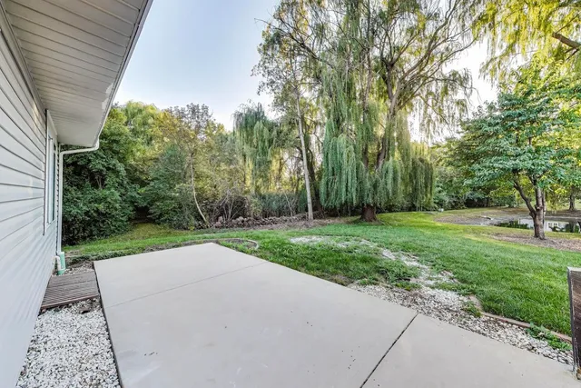 a view of backyard with green space