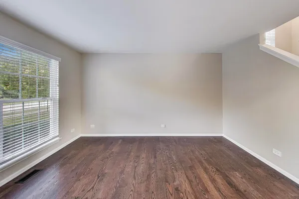 a view of wooden floor and brick walls