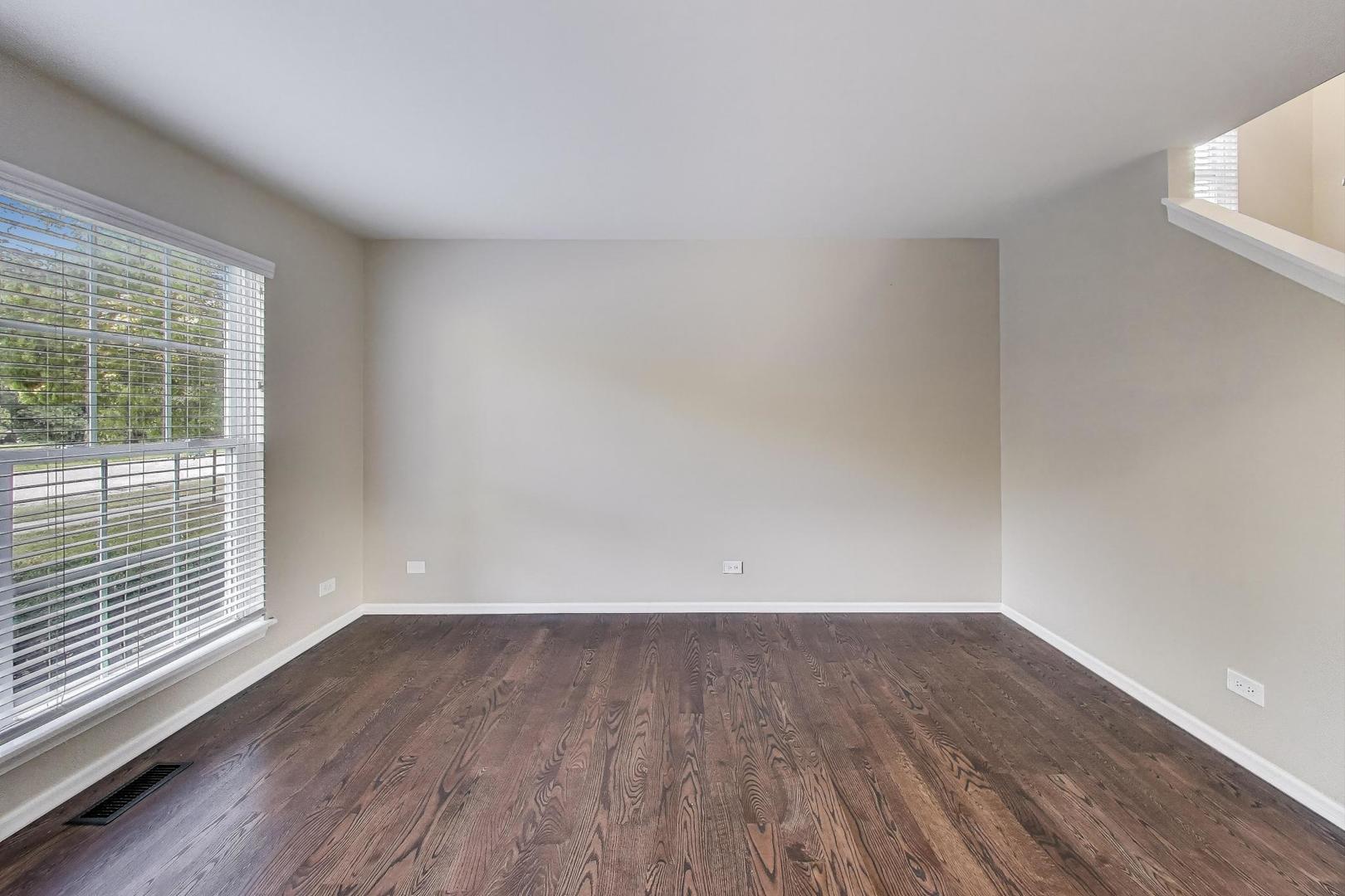 926 South W Avenue Waukegan, IL 60085 - Photo 5 of 45 a view of wooden floor and brick walls