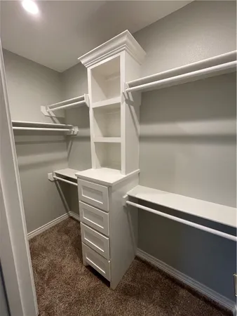a storage room with washer and dryer