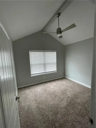 an empty room with windows and entrance