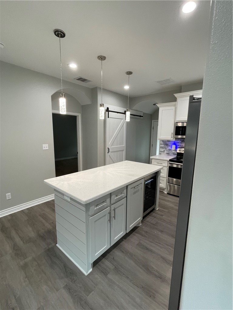 509 Jane Street Corpus Christi, TX 78418 - Photo 6 of 15 a kitchen with stainless steel appliances a white stove top oven and refrigerator