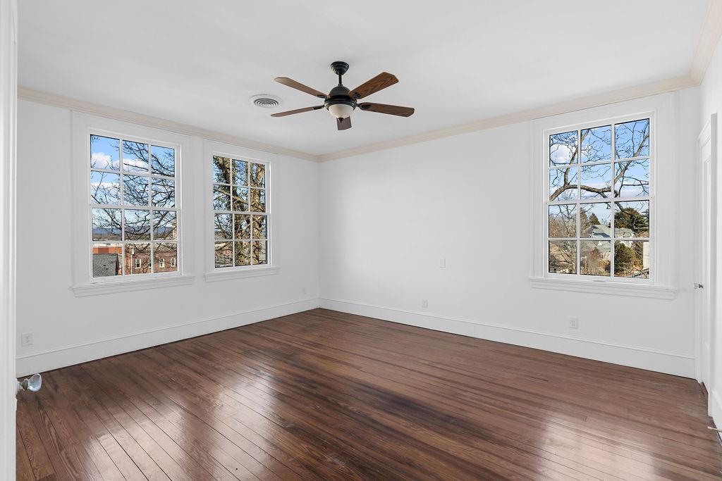 312 East 3rd Street Rome, GA 30161 - Photo 39 of 42 a view of empty room with wooden floor and fan