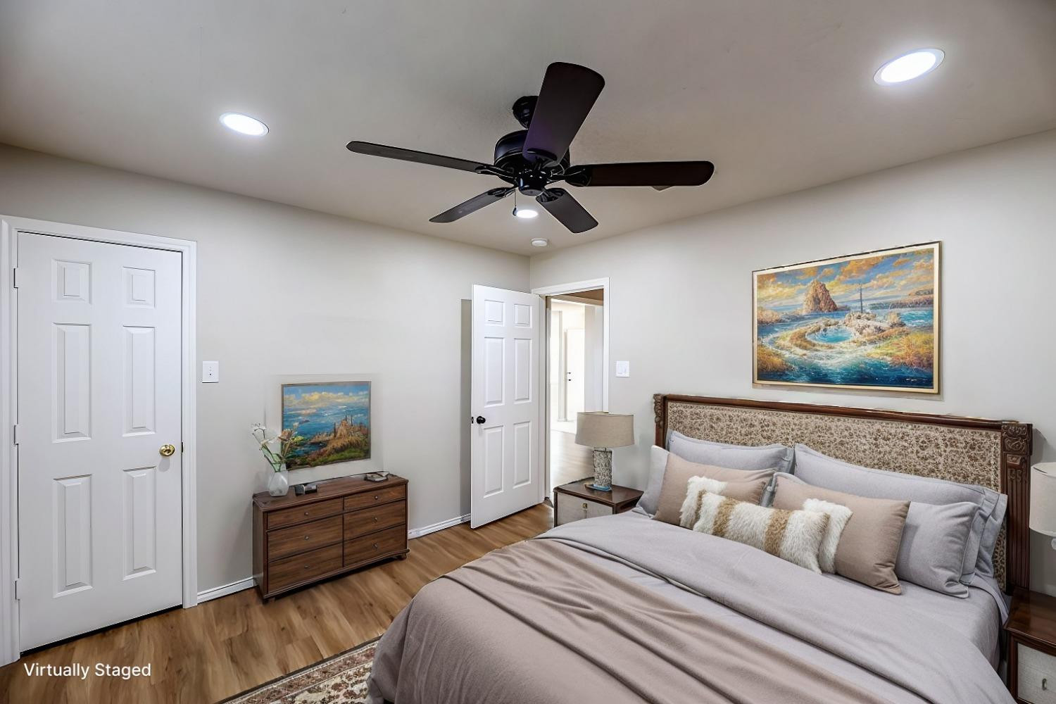 6536 7th Street Lubbock, TX 79416 - Photo 16 of 23 a bedroom with a bed and a chandelier