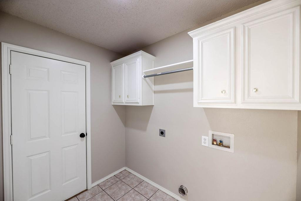 6536 7th Street Lubbock, TX 79416 - Photo 21 of 23 a view of small space with racks on the wall