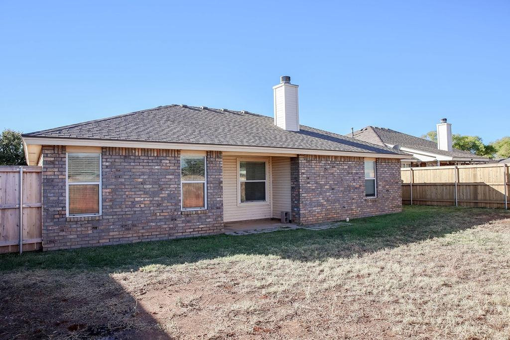 6536 7th Street Lubbock, TX 79416 - Photo 22 of 23 a front view of a house with a garden