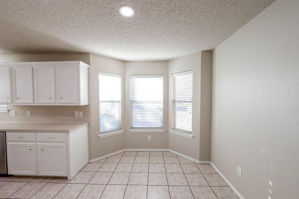 6536 7th Street Lubbock, TX 79416 - Photo 9 of 23 a view of an empty room with a window