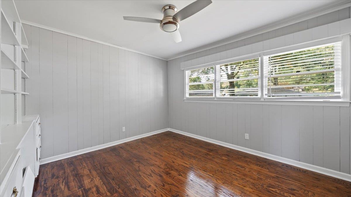 176 North Rose Road Memphis, TN 38117 - Photo 12 of 24 an empty room with a window and wooden floor