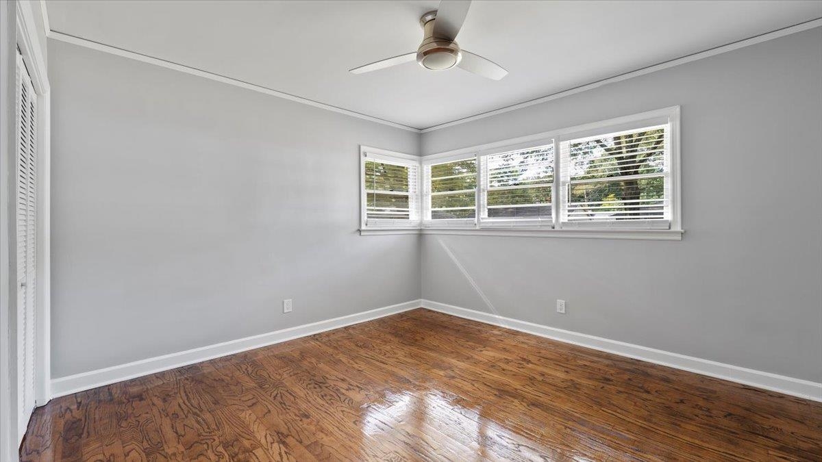 176 North Rose Road Memphis, TN 38117 - Photo 15 of 24 a view of empty room with wooden floor and fan