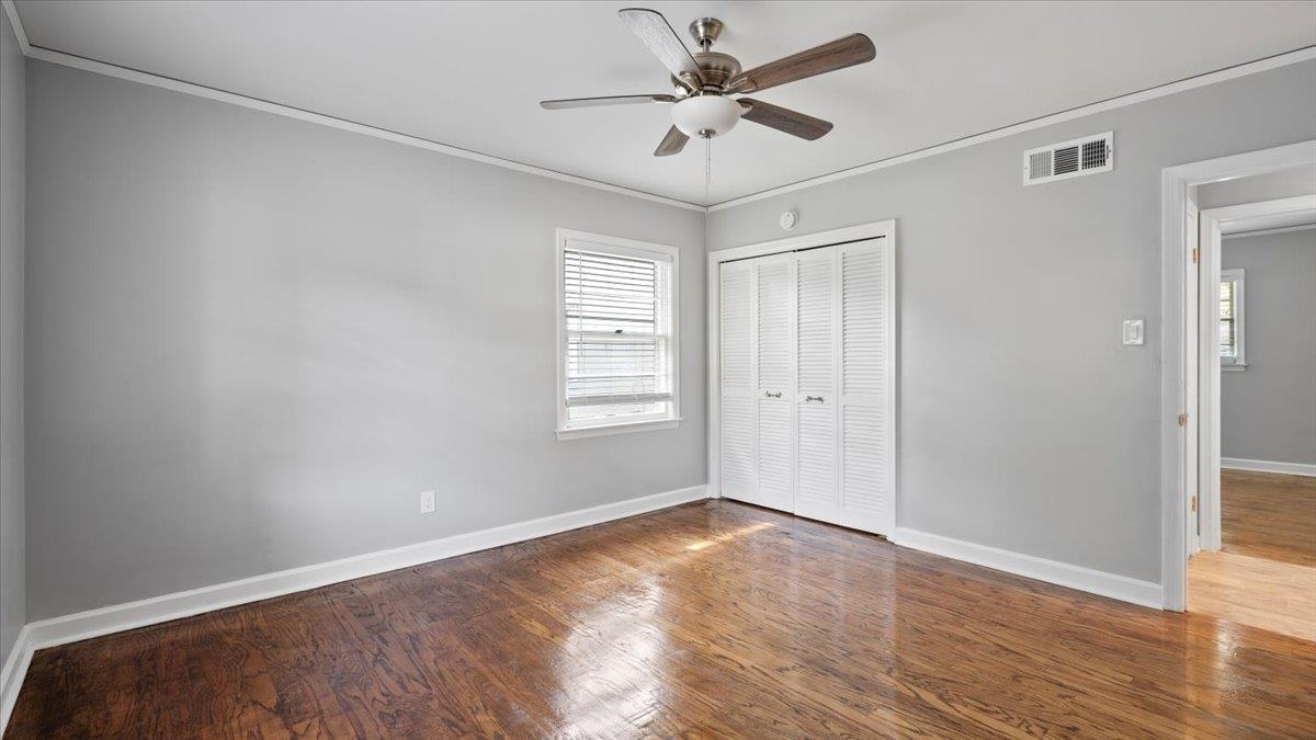 176 North Rose Road Memphis, TN 38117 - Photo 18 of 24 a view of an empty room with wooden floor and a window