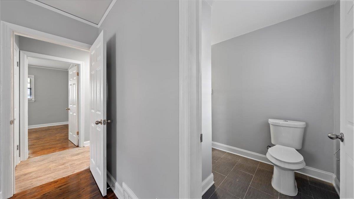 176 North Rose Road Memphis, TN 38117 - Photo 19 of 24 a white toilet sitting next to a shower