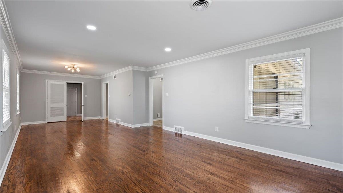 176 North Rose Road Memphis, TN 38117 - Photo 3 of 24 wooden floor in an empty room with a window