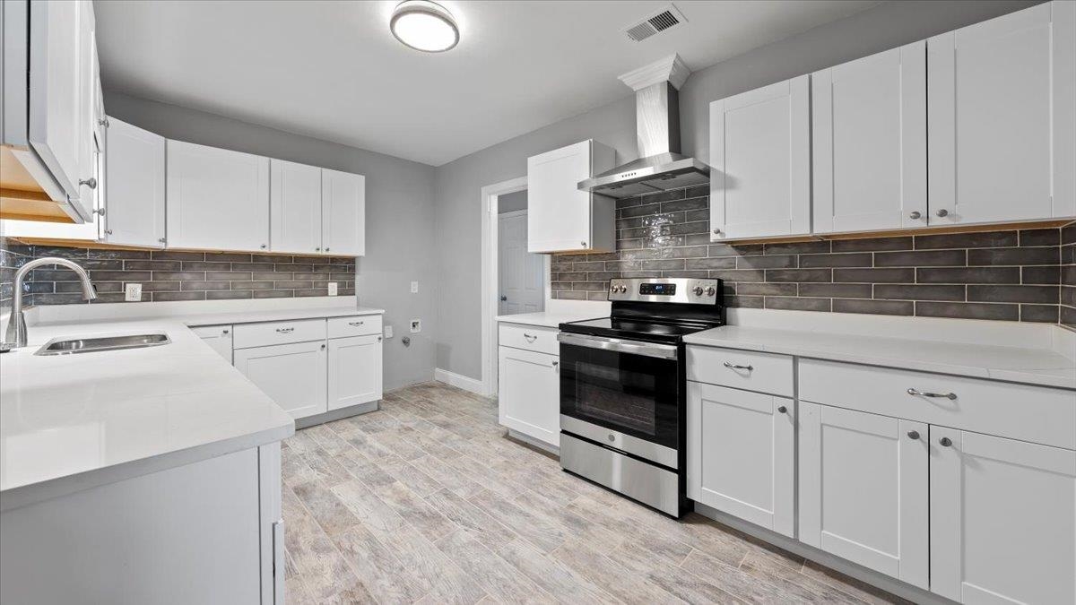 176 North Rose Road Memphis, TN 38117 - Photo 6 of 24 a kitchen with white cabinets stainless steel appliances and sink