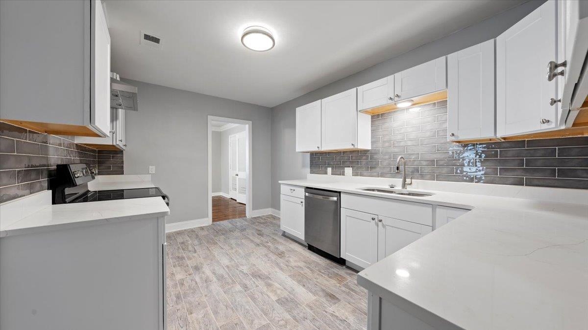 176 North Rose Road Memphis, TN 38117 - Photo 7 of 24 a kitchen with a sink stove top oven and cabinets