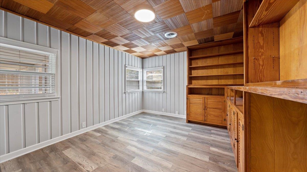 176 North Rose Road Memphis, TN 38117 - Photo 8 of 24 a view of empty room with wooden floor and windows
