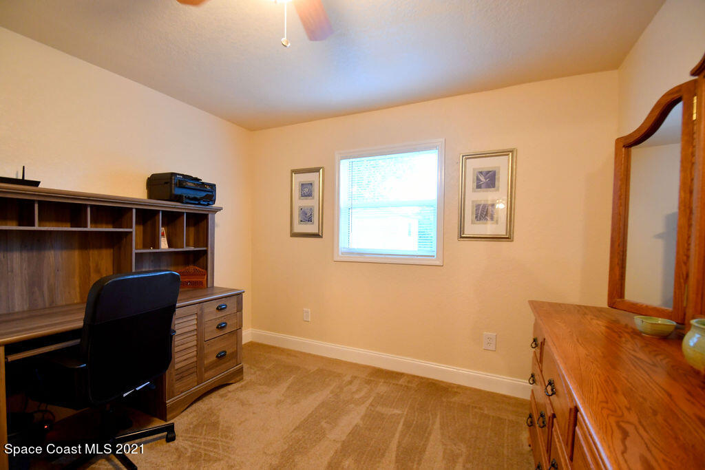 1461 Creel Road Northeast Palm Bay, FL 32905 - Photo 13 of 20 a view of workspace with wooden floor