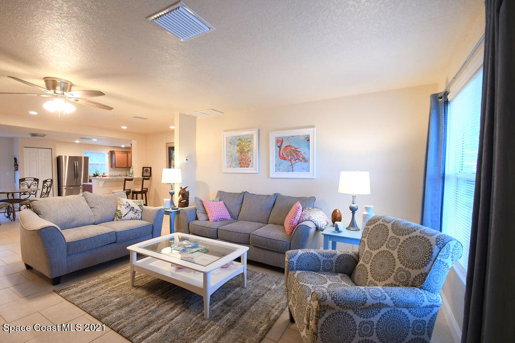 1461 Creel Road Northeast Palm Bay, FL 32905 - Photo 8 of 20 a living room with furniture and a couch