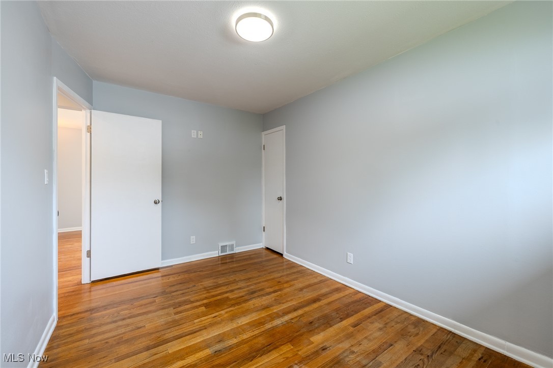 29971 Regent Road Wickliffe, OH 44092 - Photo 16 of 39 Empty room featuring wood finished floors and baseboards