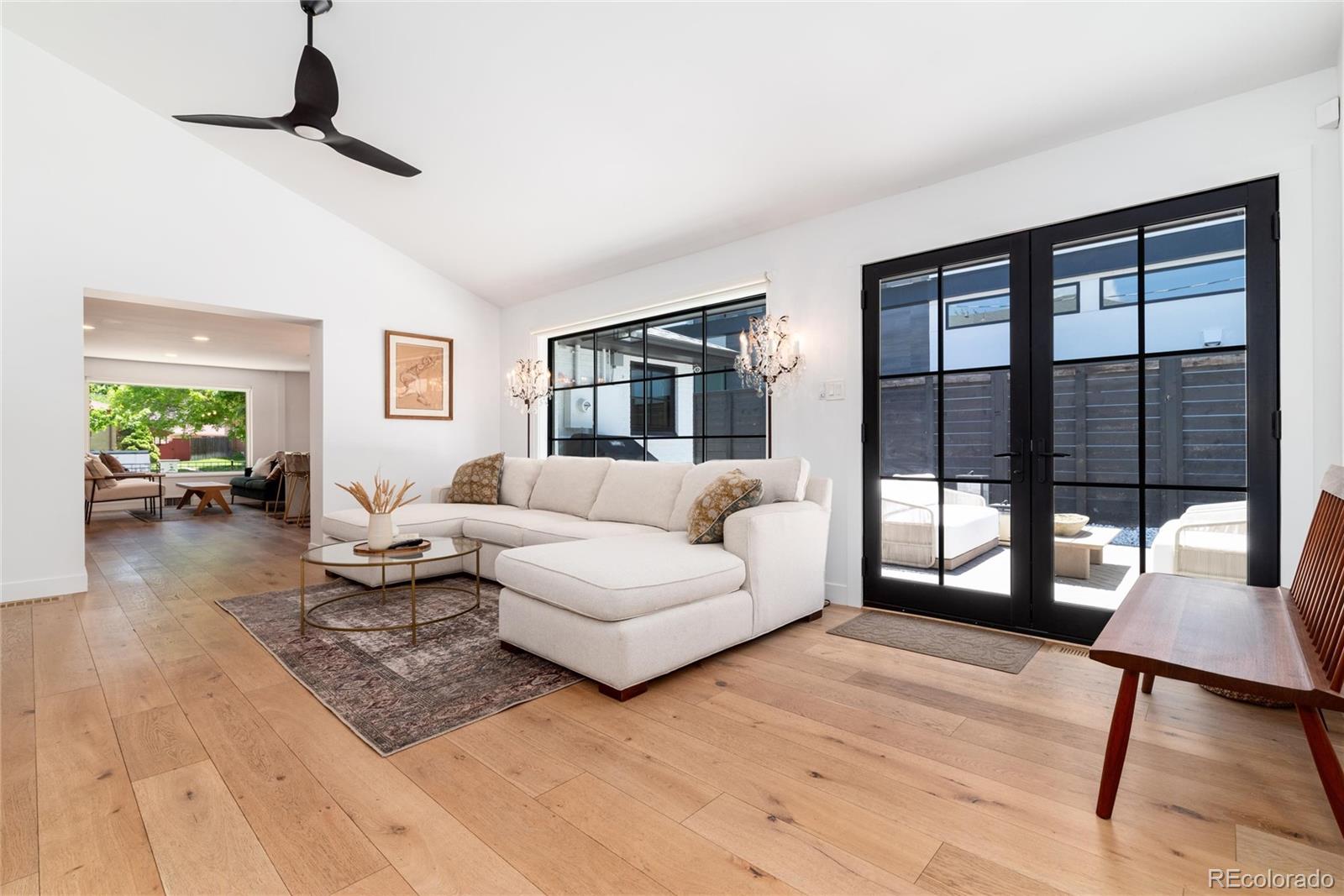 1065 South Monroe Street Denver, CO 80209 - Photo 12 of 32 a living room with furniture and a window