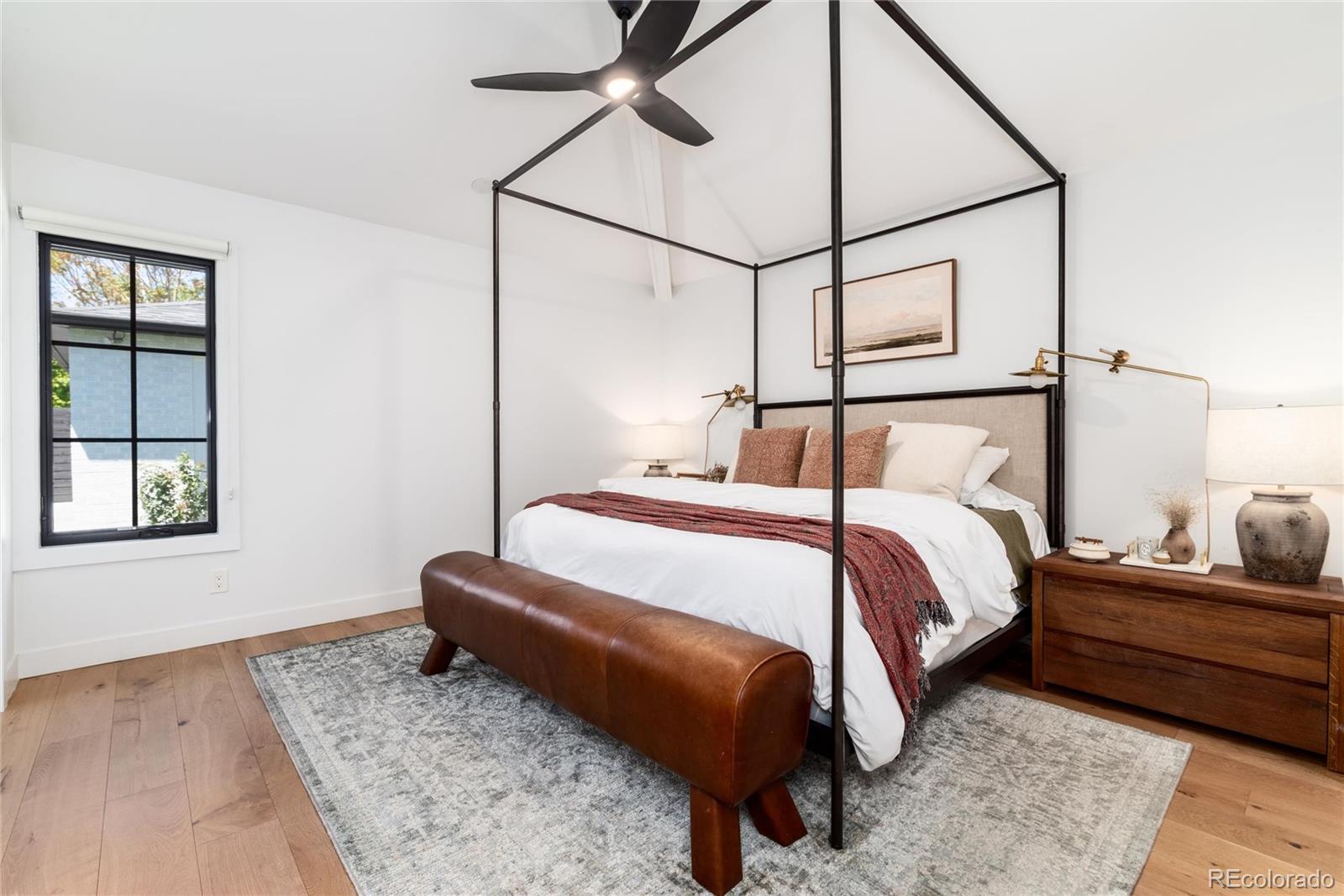 1065 South Monroe Street Denver, CO 80209 - Photo 13 of 32 a bedroom with a bed and window