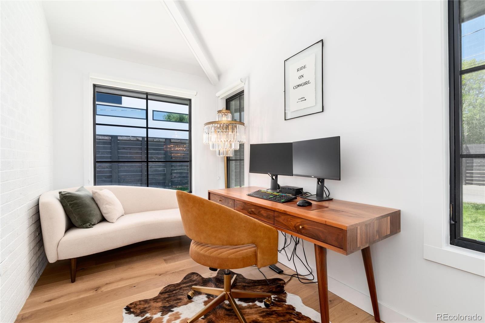 1065 South Monroe Street Denver, CO 80209 - Photo 15 of 32 a view of a workspace with furniture and a couch