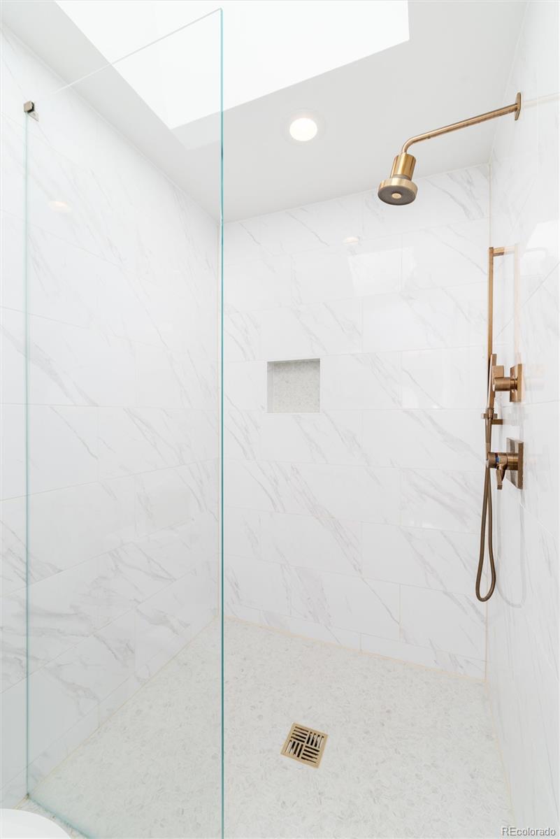 1065 South Monroe Street Denver, CO 80209 - Photo 18 of 32 a bathroom with a shower