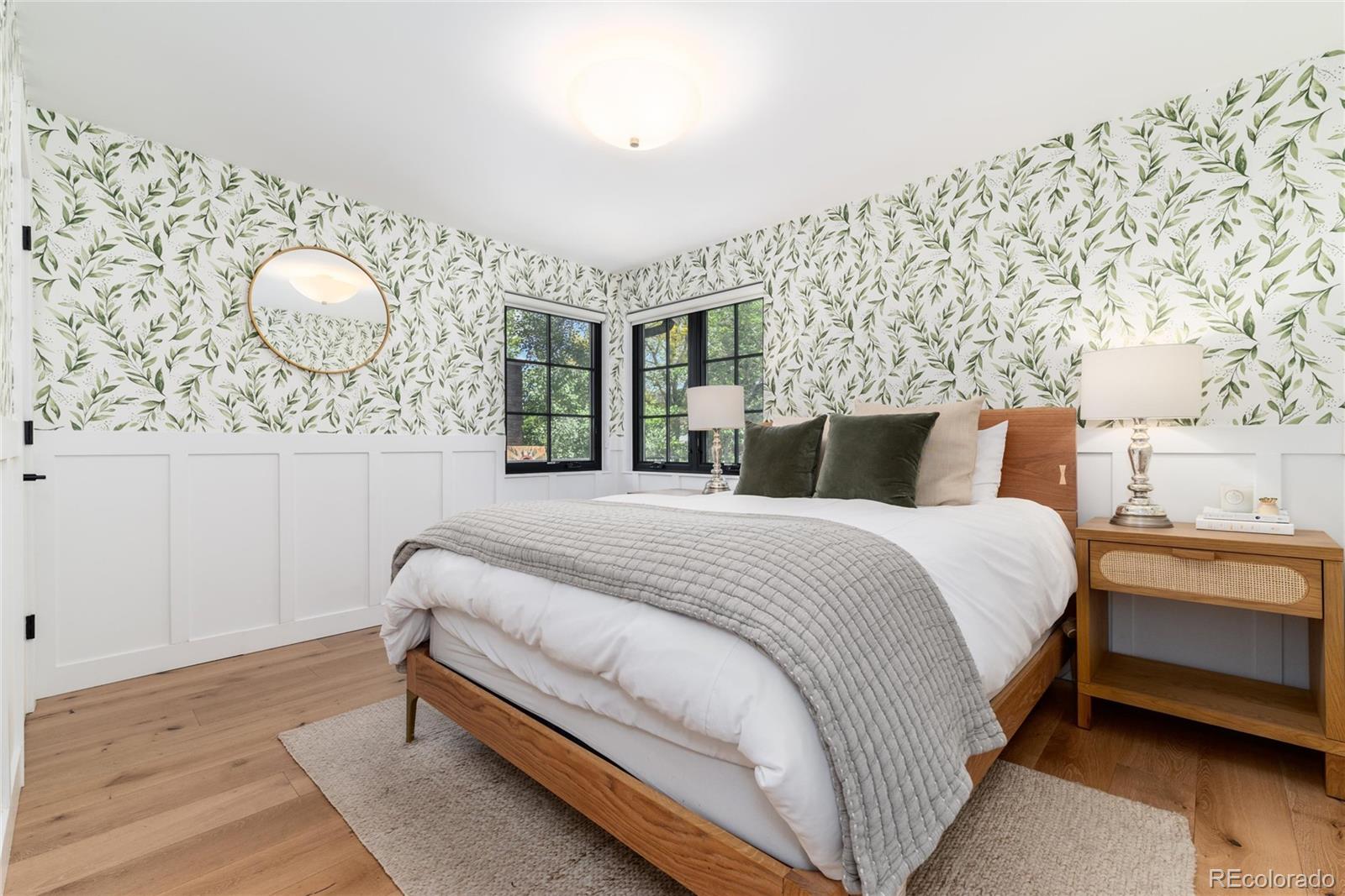 1065 South Monroe Street Denver, CO 80209 - Photo 22 of 32 a bedroom with a bed and lamp