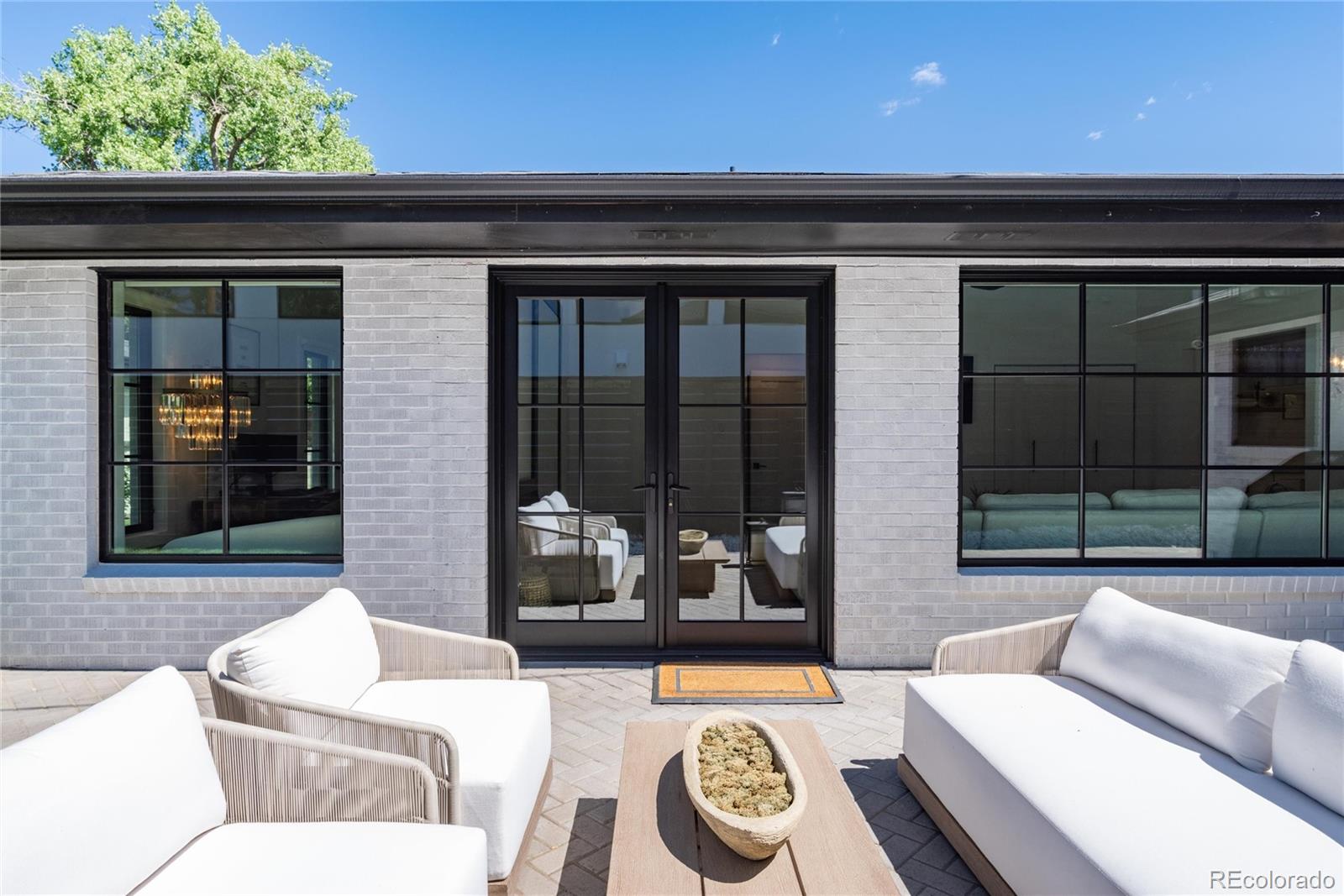 1065 South Monroe Street Denver, CO 80209 - Photo 24 of 32 a living room with furniture and a window
