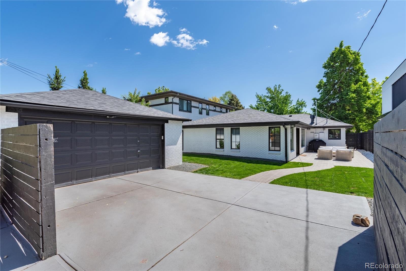 1065 South Monroe Street Denver, CO 80209 - Photo 28 of 32 a view of house with outdoor space and yard
