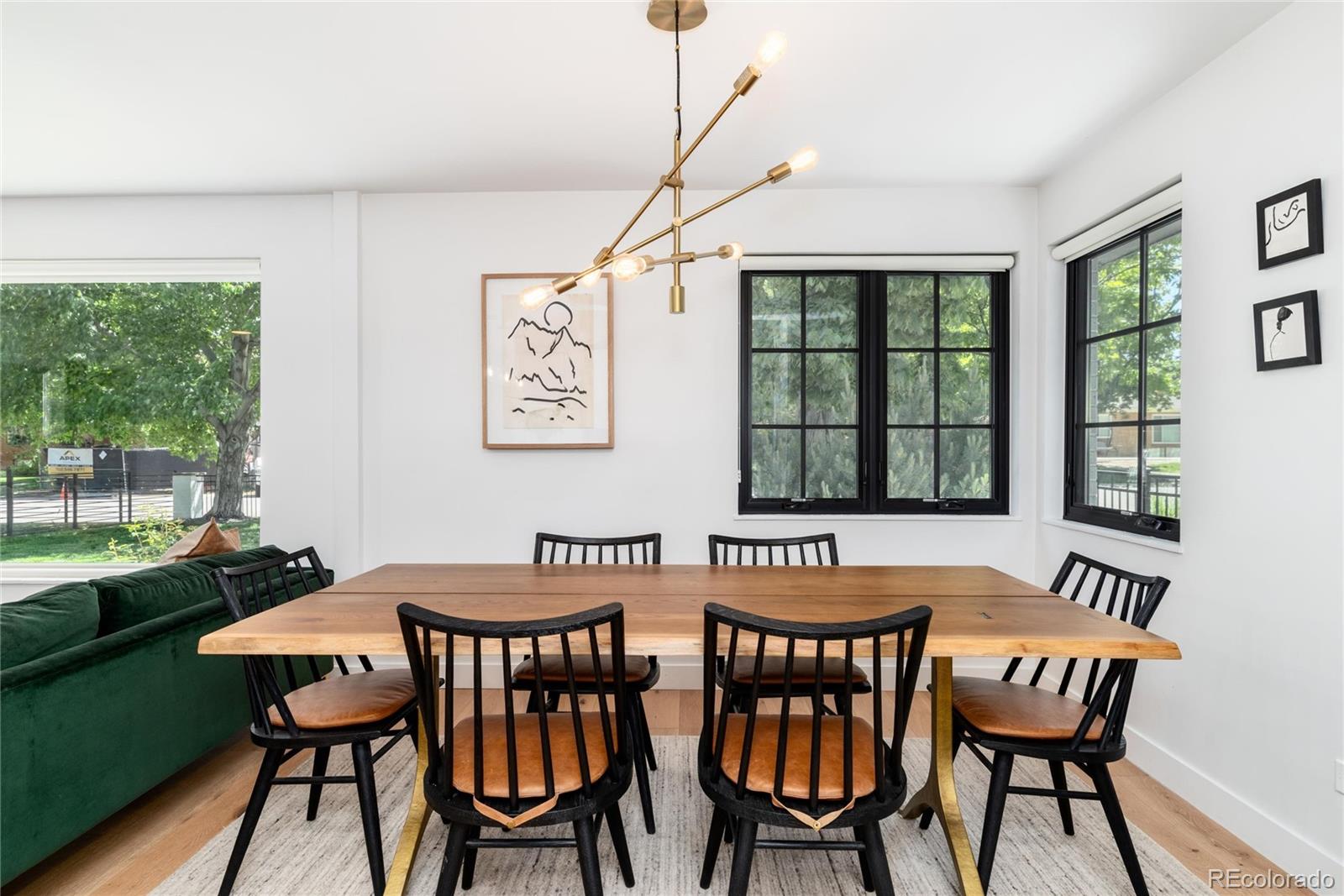 1065 South Monroe Street Denver, CO 80209 - Photo 8 of 32 a view of a dining room with furniture window and outside view