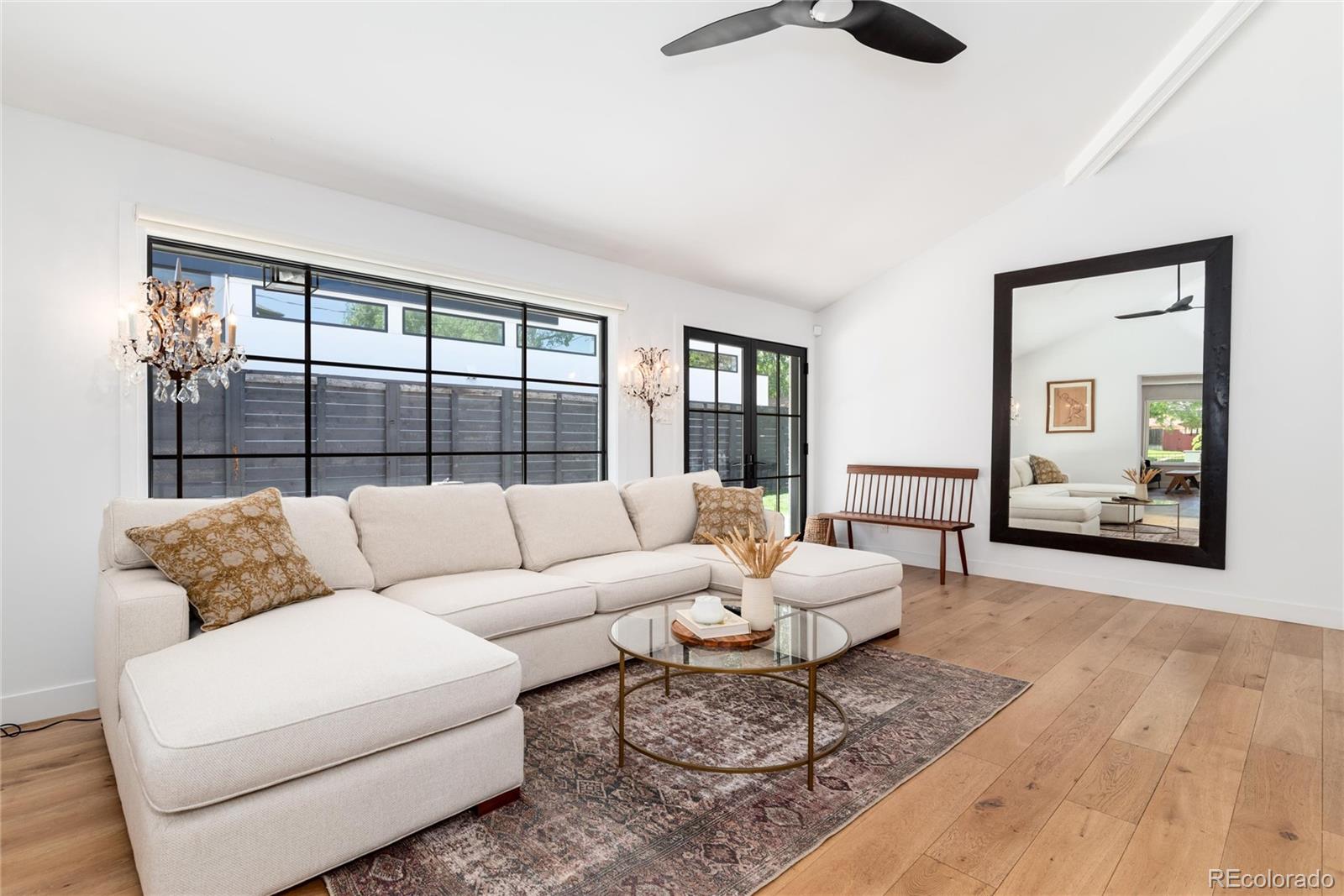 1065 South Monroe Street Denver, CO 80209 - Photo 10 of 32 a living room with furniture and a large window