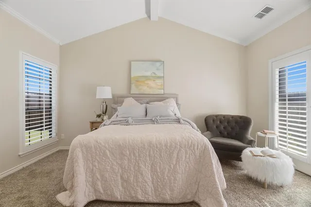 a bedroom with a bed and window