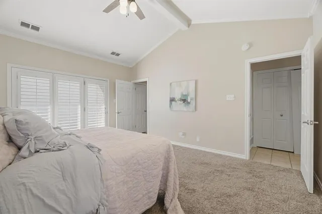 a large white bed in a white room
