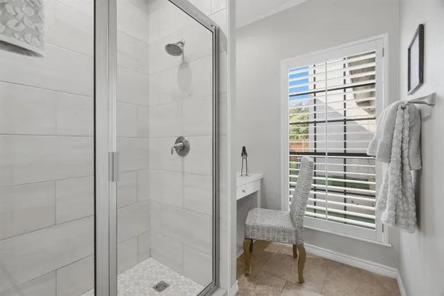 a bathroom with a shower and a sink