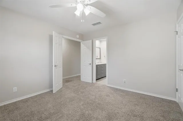 an empty room with a bathroom