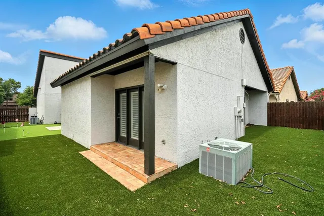 a view of a backyard with a tub