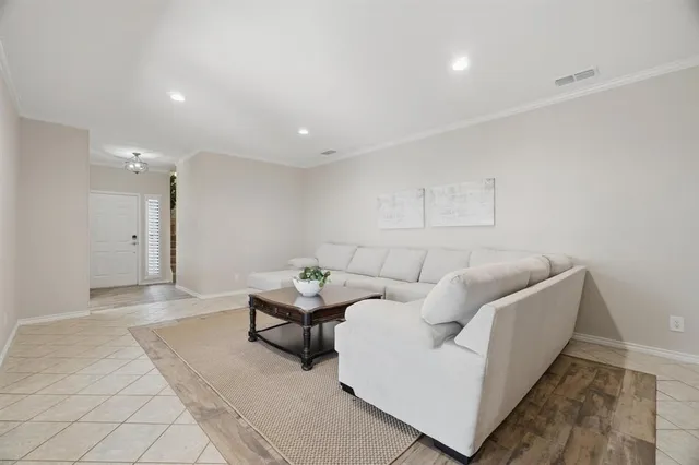 a living room with furniture and a couch