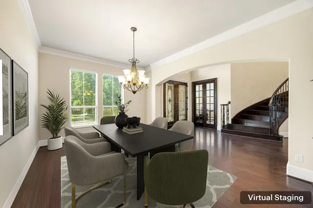 a view of a livingroom with furniture window and wooden floor